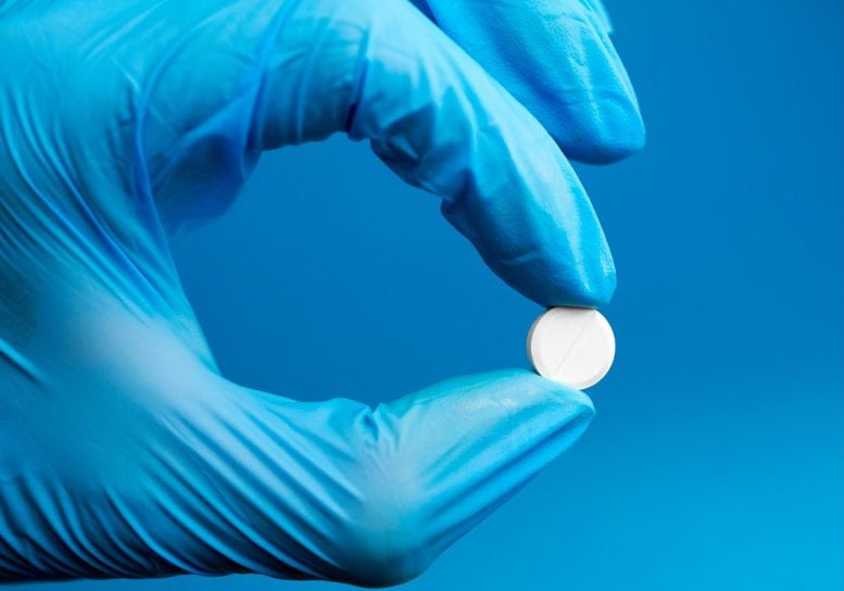 Scientist Holding Pill
